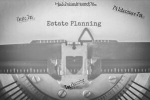 Making charitable donations part of your estate plan. Typewriter image with estate tax, PA Inheritance tax, and estate planning written out. 