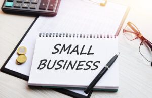 Seven Tax Considerations for New Businesses. An image of a small white tablet with Small Business written on it. Business law and business tax. 
